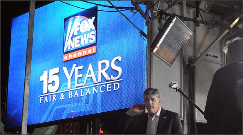 Sean Hannity stands below a large Fox News projection shows 15 years "Fair & Balanced" despite proof otherwise